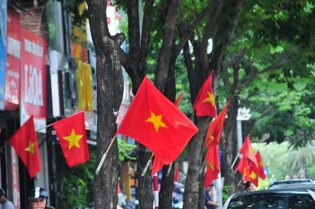 The streets of Vietnam are decked out in red for the April 30 holiday, with flags, banners and posters commemorating the country's reunification.