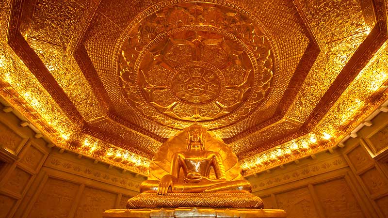 The Buddha statue in the center of the first floor of the stupa