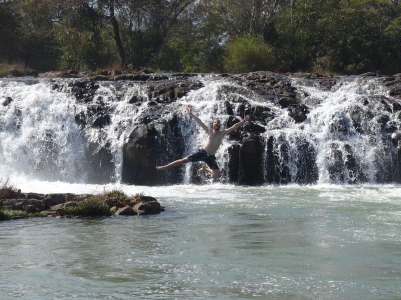 Travelers can swim freely at the foot of the waterfalls