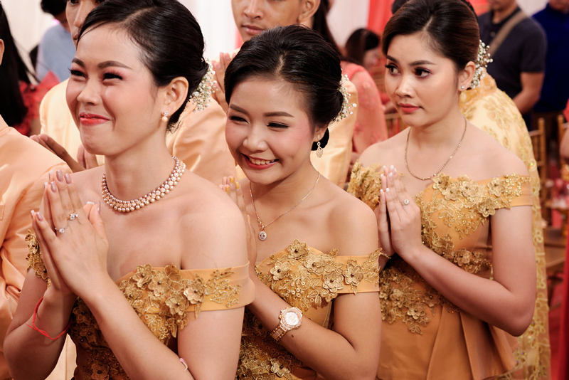 Cambodian bridesmaids doing a sampeah