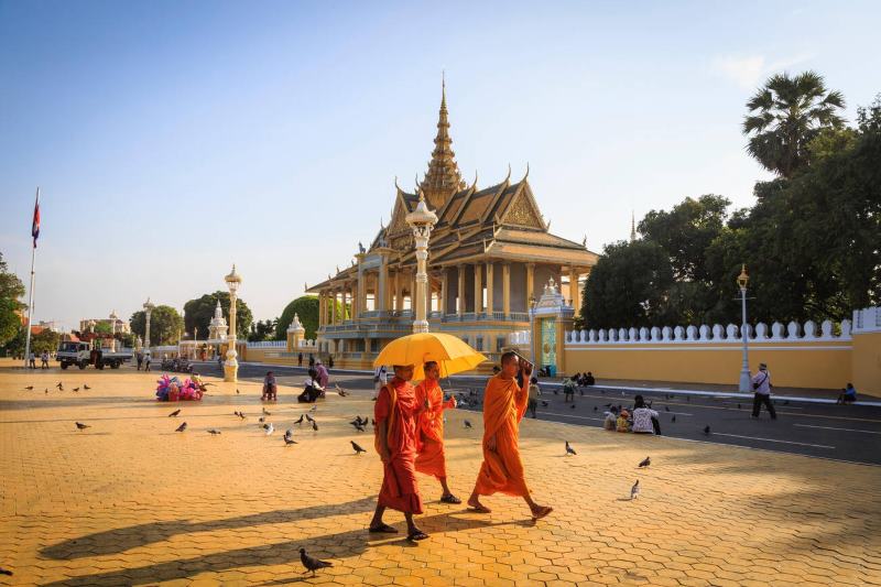 Buddhist monks in a square in front of the Royal Palace in Phnom Penh, Cambodia