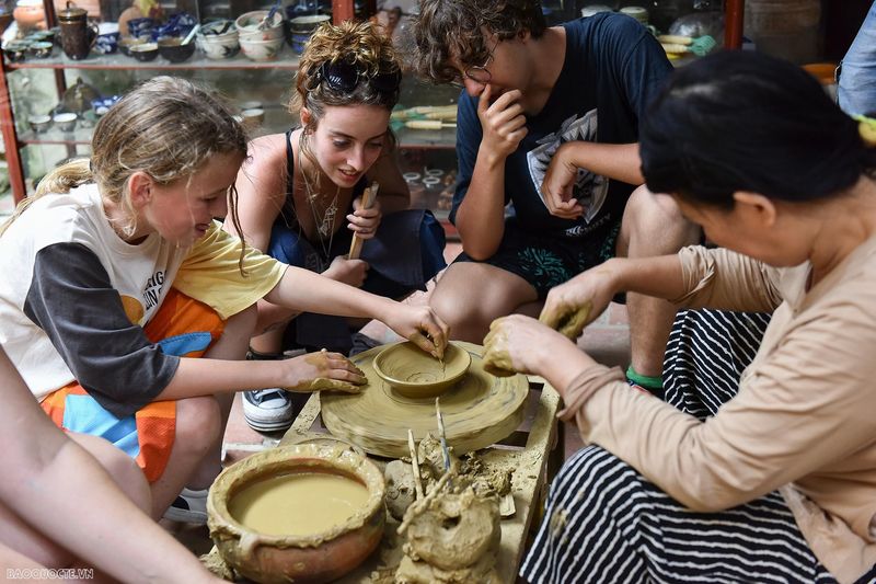 Tourists practicing pottery making in Bat Trang village