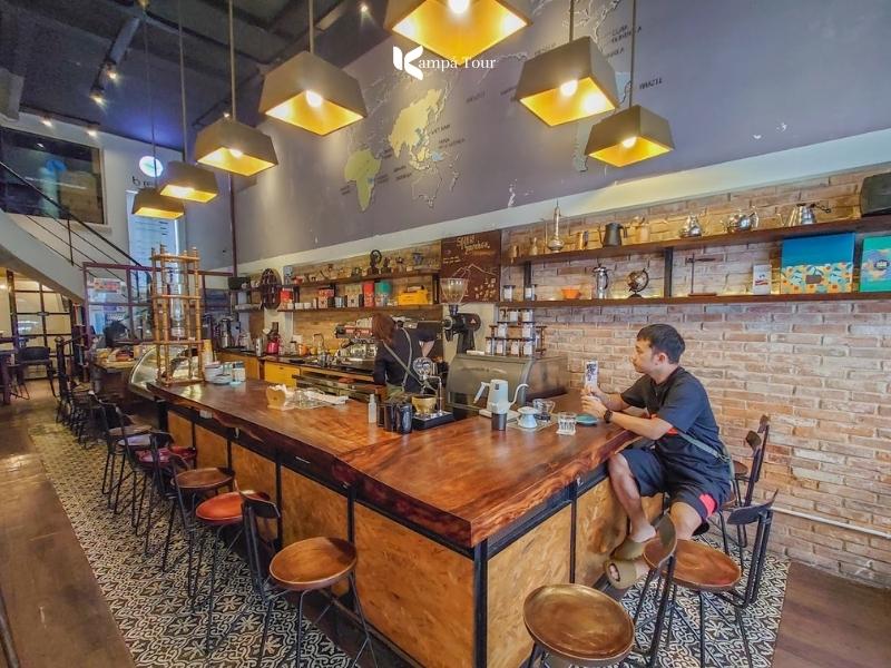 Polished seating built around a central bar at Bosgaurus Coffee, Opera House branch