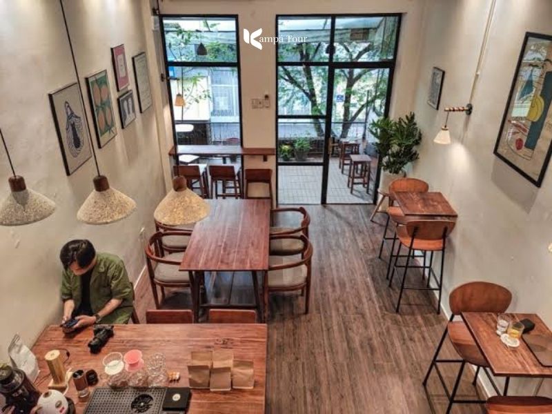Upstairs cafe in an old apartment building at 42 Ly Tu Trong, a plain and cozy room
