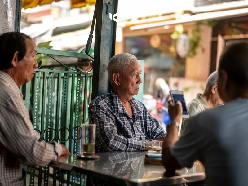 Small cloth-filter coffee stall at the end of an alley in former District 3, Saigon
