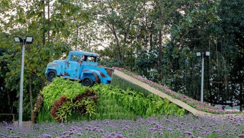 Car in a flower-filled garden