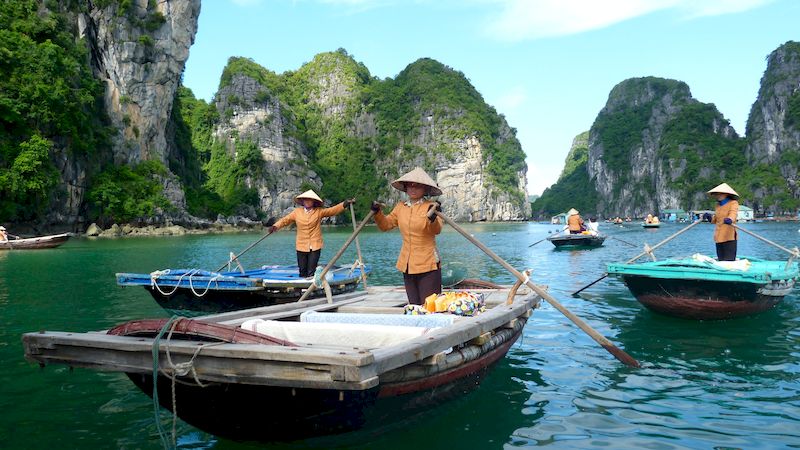 You can experience a boat ride through unique caves in Halong Bay