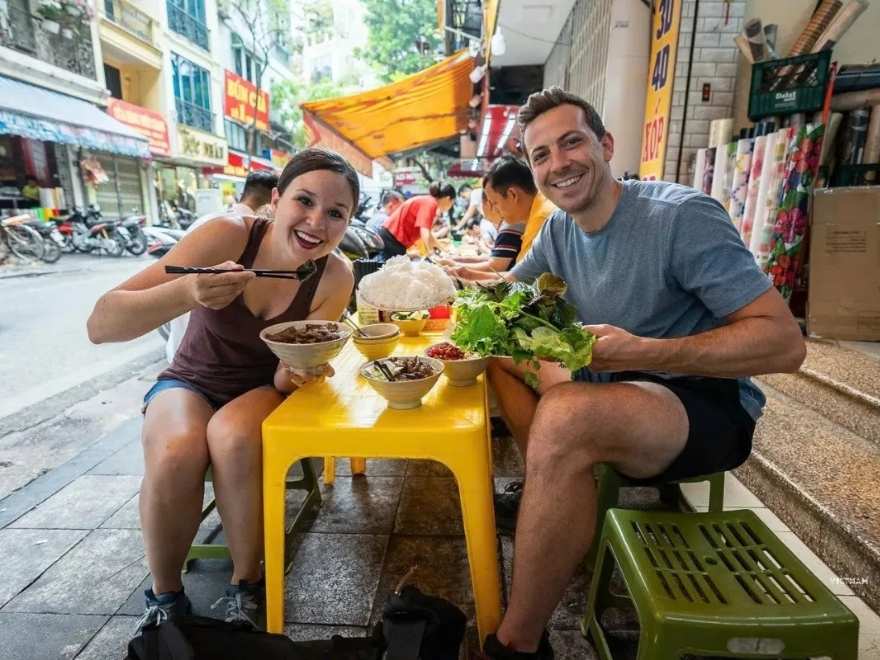 Hanoi morning street scene in September with a bun cha vendor