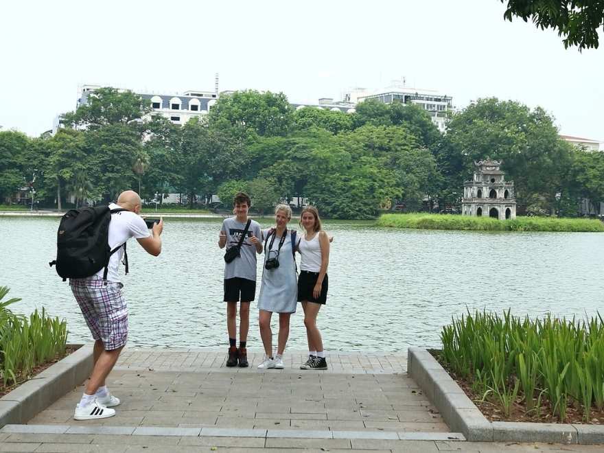 Hoan Kiem Lake in August morning with local people exercising