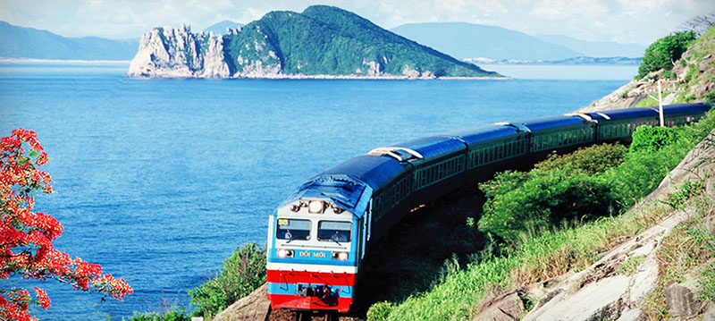 The north-south train travels along the seaside in central Vietnam