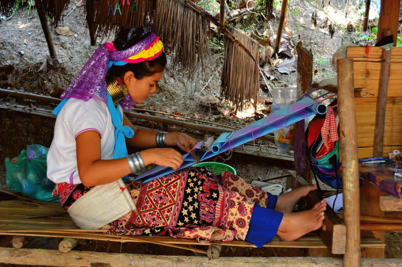 The local woman makes silk by hand