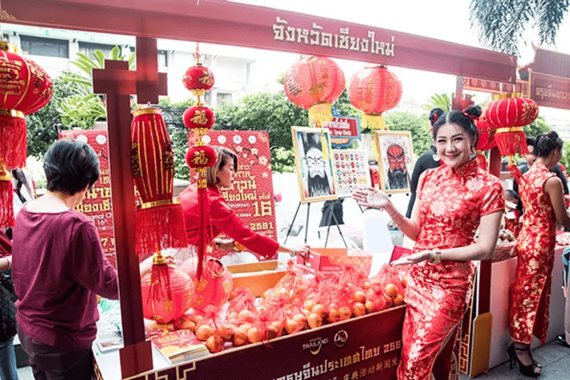 Thai people dressing in Red with their New Year Booths