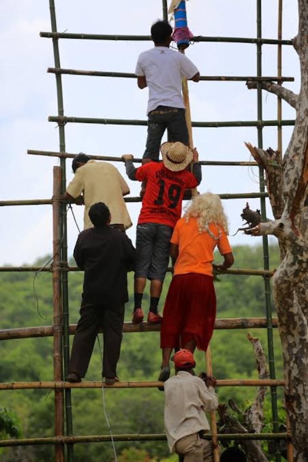 the locals queueing on a ladder to see the rockets