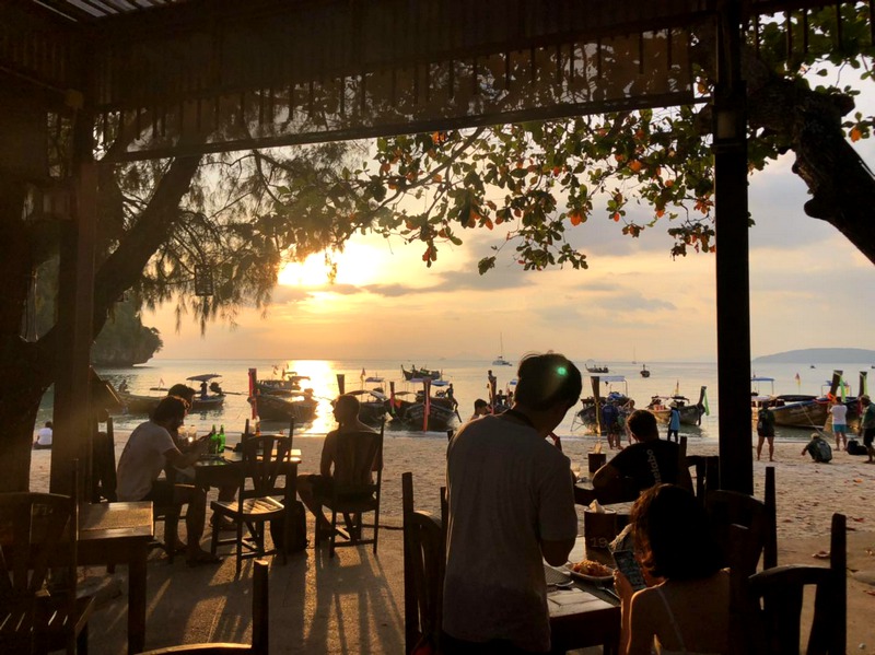 The magic of a sunset at the Sand Sea Resort while watching the locals with their traditional boats