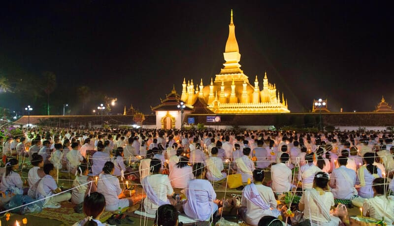 On the occasion of the That Luang festival, Laotians gather around the stupa and pray