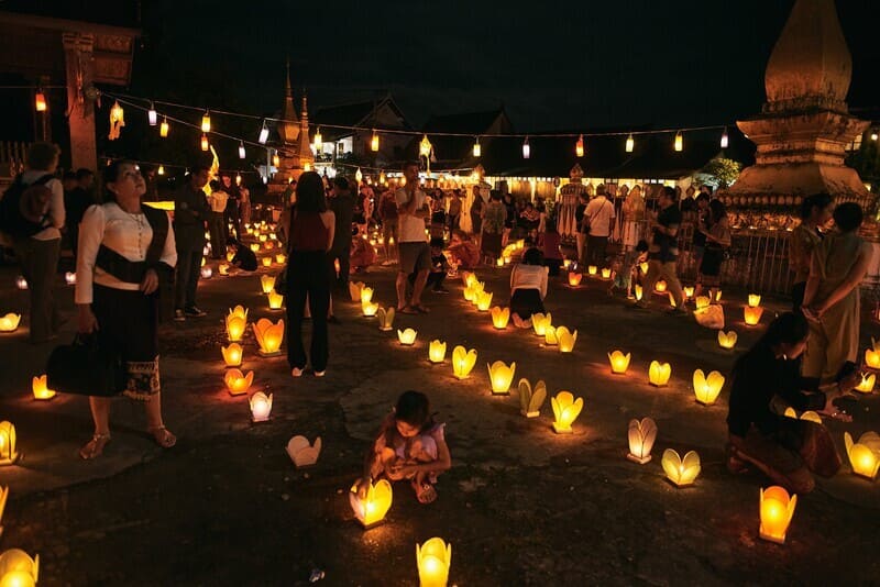 In the evening, the That Luang festival transforms into a bright and vibrant spectacle