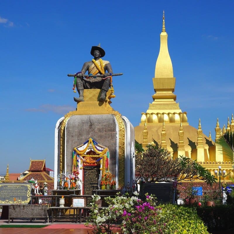 The statue of King Setthathirath, one of the most illustrious in the history of Laos, stands today in front of the stupa