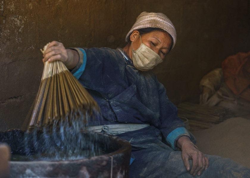 Nung An women in Phia Thap are taught to make incense from a young age, and this work continues into their old age.
