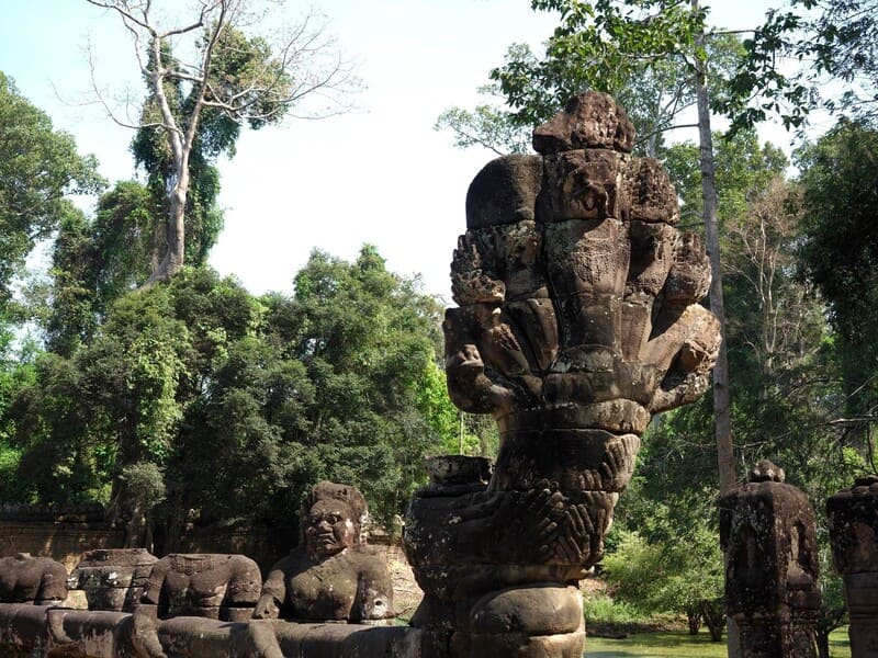 At the entrance to the temple of Preah Khan, a naga carved in stone still guards the passage