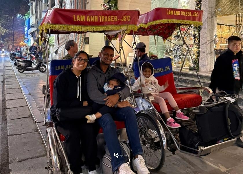 The tourist family was excited to experience riding a cyclo in Hanoi