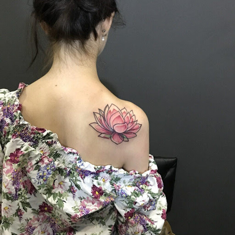 Lotus tattoos for women symbolize purity, strength, femininity, and bring prosperity and luck.