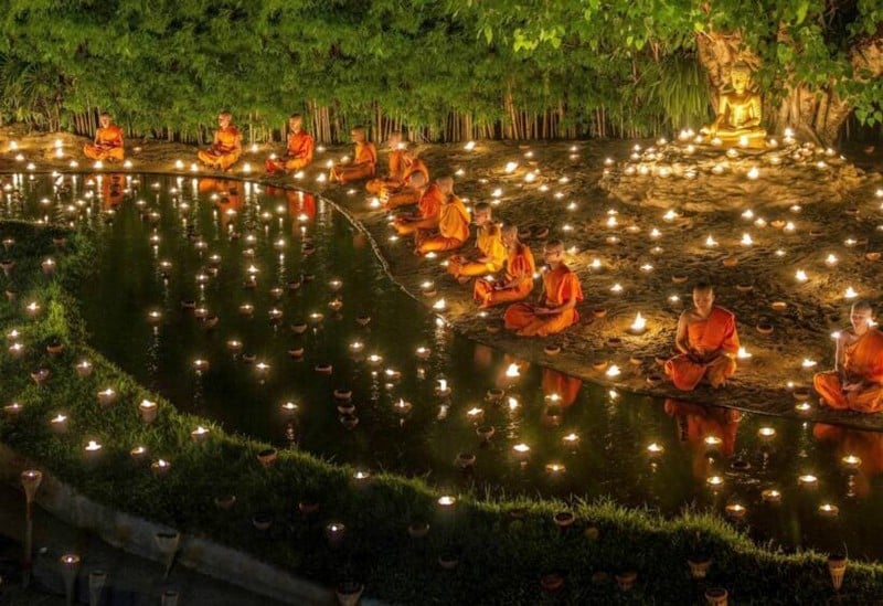 Asahna Bucha Day with burning candle