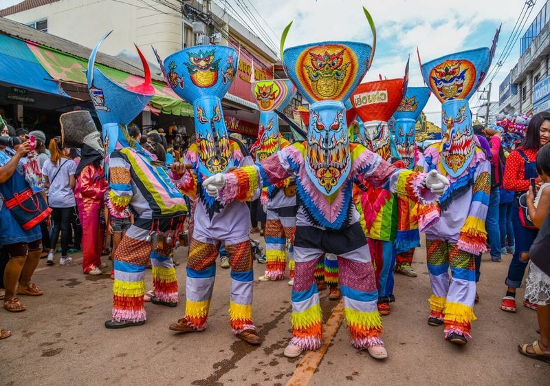 Colorful Celebration: Phi Ta Khon Festival in the street.