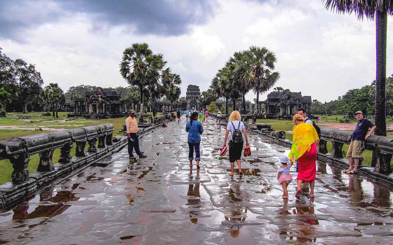 After the rain: Tourists in Angkor.