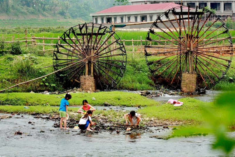 The quiet scene in a field in Pu Luong, with traditional water wheels