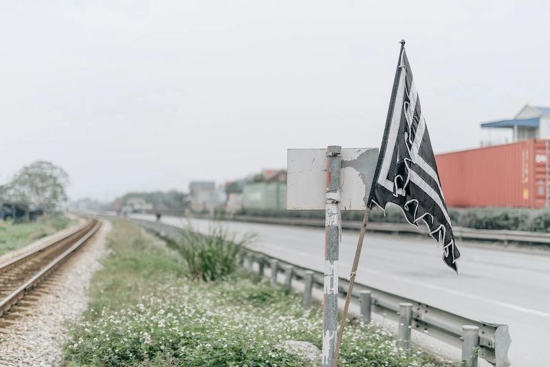 The funeral flag has 2 colors which are black and white