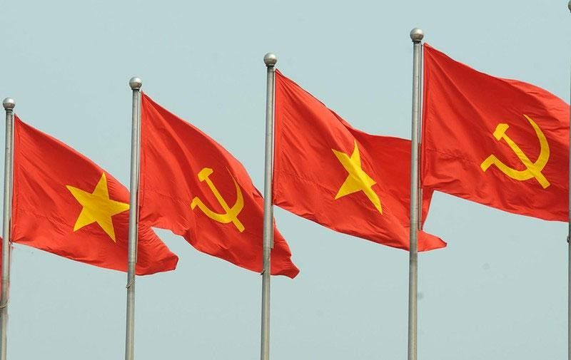 In some places the communist flag is placed next to the national flag.