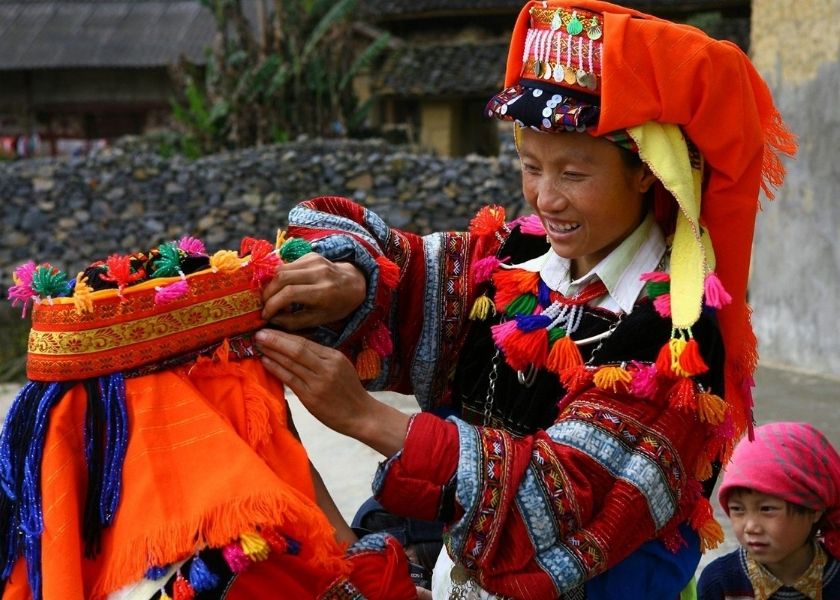 The Lolo Hoa people in their brightly colored red clothing.