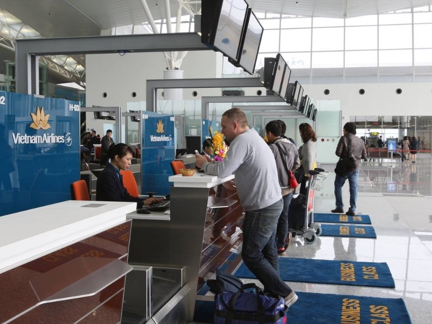 Passport, boarding pass and e-visa document for travelers checking Vietnam stopover visa requirements