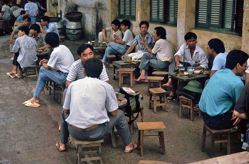 Hanoians drinking beer on sidewalks in the 70s