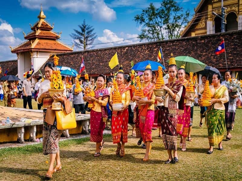 Women with traditional Lao New Year outfits in Bunpimay festival