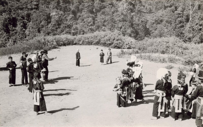 White Hmong young men and women play ball at Hong New Year - Photographer: Sage, William