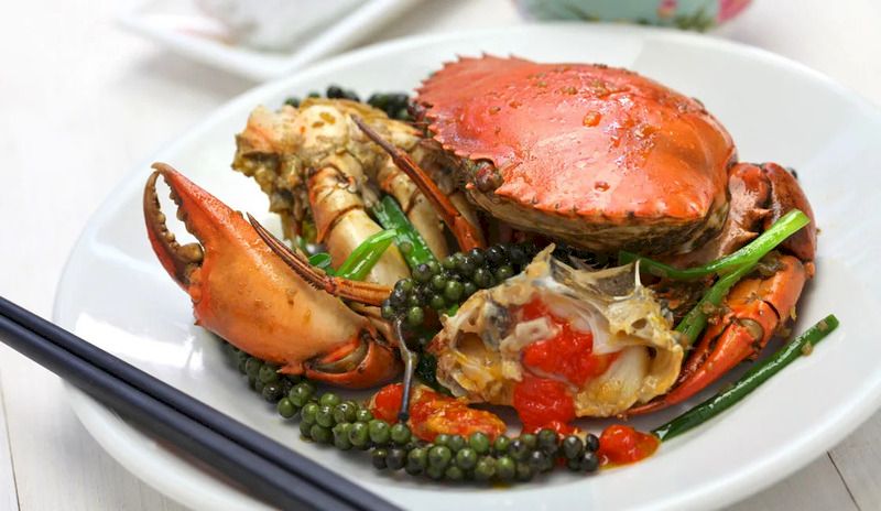 Kdam Chaa is Fried Green Pepper Crab made from whole shell crabs with kampot pepper and spices
