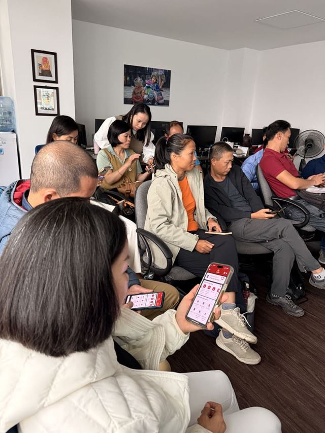 The guides are performing the operations on their phones.