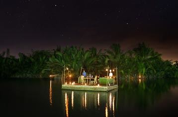 Romantic dinner on the bamboo raft