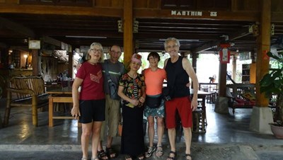 Enjoying a warm welcome from locals at the homestay with Mrs. Nadine and Marie's family.