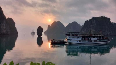 A serene sunrise over Ha Long Bay, capturing the breathtaking beauty of Vietnam's iconic landscape