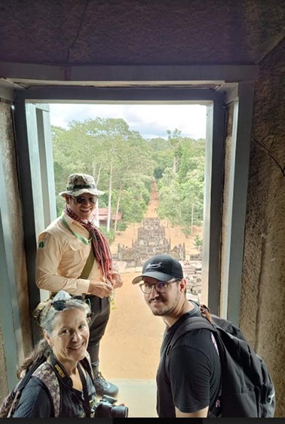 They take in the breathtaking view from Banteay Srei temple.