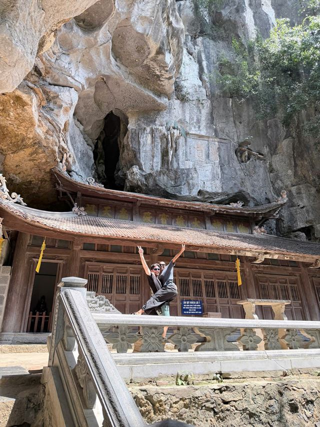 A temple nestled in the mountains and surrounded by nature: one of the many hidden treasures that make travelling through Ninh Binh such a unique experience.