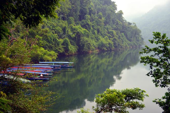 Mountains hug Ba Bes serene waters