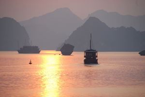 Sunset serenity over the tranquil waters of Ha Long Bay.