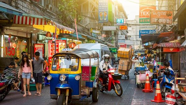 Experience a ride through the capital of Bangkok by tuk tuk!