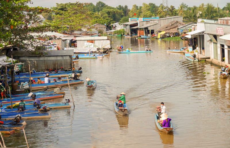 Life flows gently along the Mekong Deltas winding waterways.