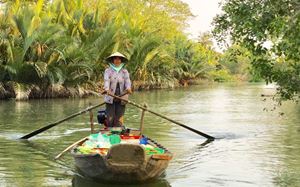 Woman on a boat in the Mekong Delta