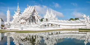 Wat Rong Khun, the White Temple, captivates with intricate ivory elegance